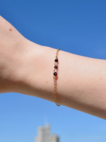 Théa - Stainless steel, rock crystal and garnet bracelet